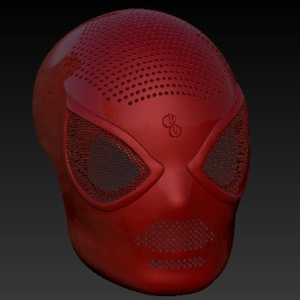 May include: A glossy red mask with a textured surface and mesh eye coverings. The mask has a series of small holes across the top and mouth area. A small emblem is visible on the forehead.