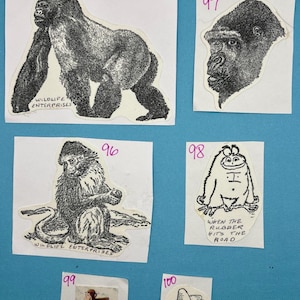 May include: Five vintage stickers featuring black and white illustrations of gorillas, monkeys, and a monster. The stickers are on white paper with black numbers in the top right corner. The stickers are numbered 95, 96, 97, 98, and 99. Sticker 98 has the text "When the rubber hits the road".