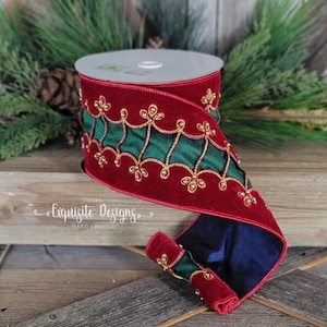 May include: A spool of wired ribbon featuring deep red velvet edges and a central dark green satin panel. The ribbon is decorated with a gold beaded scalloped trim pattern. The text Gina Exquisite Designs Hand Crafted is visible on the ribbon.