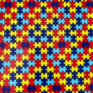 May include: A repeating pattern of puzzle pieces in blue, red, yellow, and dark blue colors.