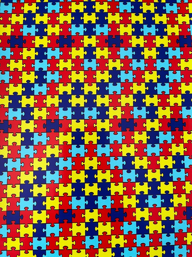 May include: A repeating pattern of puzzle pieces in blue, red, yellow, and dark blue colors.