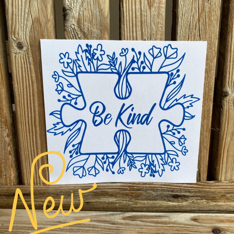 May include: Blue puzzle piece with the words "Be Kind" surrounded by a border of blue flowers and leaves on a white background.
