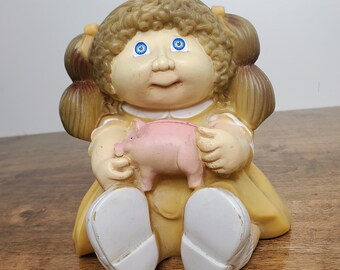 1983 Cabbage Patch Kids Piggy Bank Brown Hair Blue Eyes Holding Pink Pig