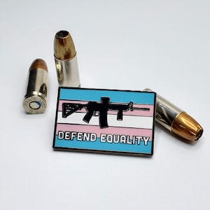 Defend Equality Trans Flag and Rifle Hard Enamel Pin image 1