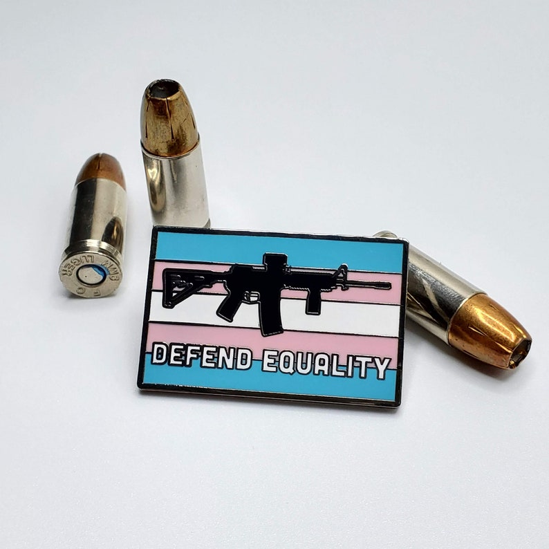 Defend Equality Trans Flag and Rifle Hard Enamel Pin image 1