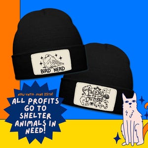 May include: Two black beanies with white patches. One patch reads "BIRD NERD" with a bird illustration. The other patch says "FRIEND TO CRITTERS" with various animal drawings. Text on the image states "ALL PROFITS GO TO SHELTER ANIMALS IN NEED!"