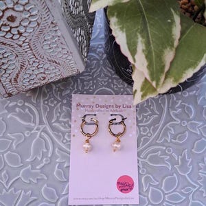 Hoop Earrings with wire wrapped fresh water pearls.