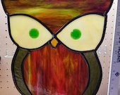 Owl - Stained glass sun catcher. Measures 10 in 12 in and includes 24 inches of black chain to hang.