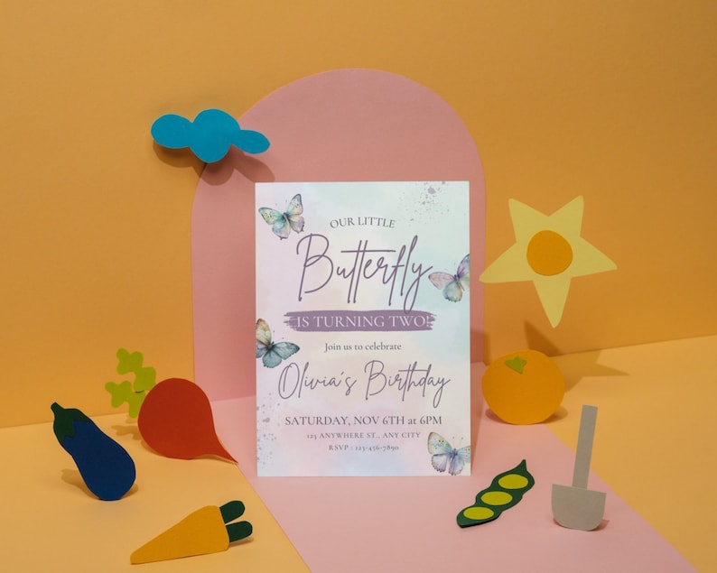 May include: A purple and white invitation with a watercolor background and butterflies. The text reads "Our Little Butterfly is Turning Two!" and "Join us to celebrate Olivia's Birthday, Saturday, Nov 6th at 6PM, Anywhere St., Any City."