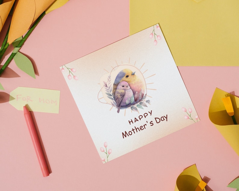 May include: A white card with a watercolour illustration of two birds in a nest. The card says "Happy Mother's Day".