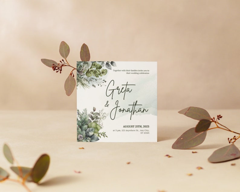 以下が含まれることがあります： 緑の葉が描かれた水彩画の背景に、「Greta & Jonathan」の文字と、「August 21th, 2023」の日付、「123 Anywhere St. Any City, ST 12345」の場所が書かれた結婚式の招待状です。