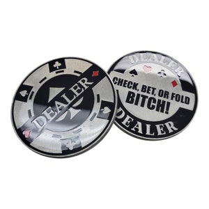 May include: Two silver poker chips with black and red designs. One chip says "DEALER" and the other says "DEALER CHECK, BET, OR FOLD BITCH!"