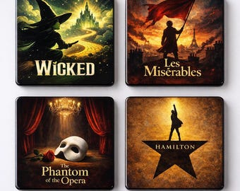 May include: Four square coasters with artwork from the musicals "Wicked", "Les Misérables", "The Phantom of the Opera", and "Hamilton". Each coaster has a glossy finish and a black border. The coasters are square.