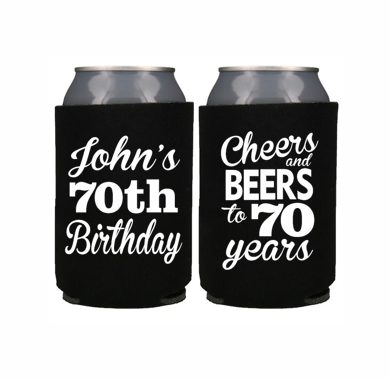 May include: Two black can coolers with white text. One cooler says "John's 70th Birthday" and the other says "Cheers and Beers to 70 years".