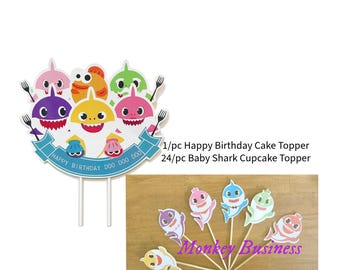 May include: A set of Baby Shark cake toppers, featuring a large cake topper with a banner that reads "Happy Birthday Doo Doo Doo" and 24 smaller cupcake toppers with various Baby Shark characters.