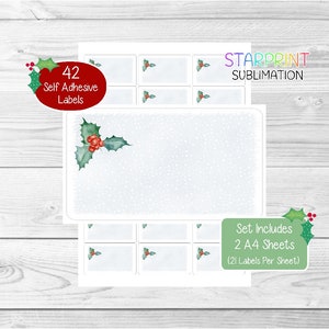Puede incluir: Un conjunto de 42 etiquetas autoadhesivas con un diseño de acebo invernal con bayas rojas y hojas verdes. Las etiquetas están impresas en hojas A4 blancas con un fondo nevado. El texto "STARPRINT SUBLIMATION" está impreso en la esquina superior derecha. El texto "Set Includes 2 A4 Sheets (21 Labels Per Sheet)" está impreso en la esquina inferior derecha.