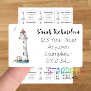 May include: White and red lighthouse sticker with a blue water base. The sticker has the text "Sarah Richardson", "123 Your Road", "Anytown Exampleton", "EX12 34U" and "Starprint Stickers".