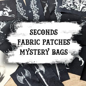 May include: A selection of black fabric patches featuring white illustrations of a deer, rat, eye, axes, and other gothic designs. The image includes the text "SECONDS FABRIC PATCHES MYSTERY BAGS".