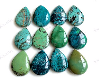 May include: Twelve turquoise gemstone cabochons in a teardrop shape. The stones are a variety of shades of blue and green, with some having a marbled or speckled pattern.