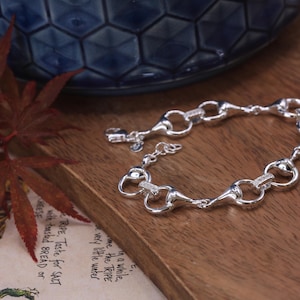 Silver Snaffle Bit Bracelet, equestrian bracelet in solid silver with sparkly links.