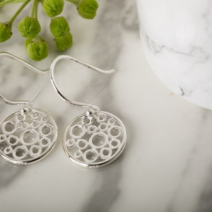 Silver Floating Bubble Drop Earrings, sterling silver hanging earrings with circular design.