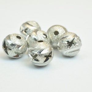 100 pcs steel plated carved round beads 10mm diamond cut