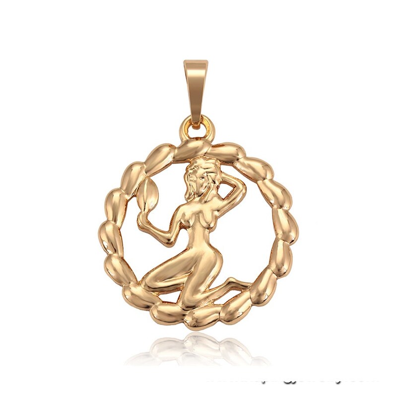 May include: Gold-toned pendant featuring the astrological symbol for Virgo, a woman holding a mirror, within a circular frame of linked ovals.