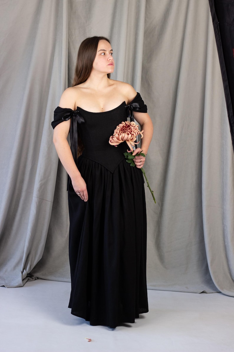 black medieval dress with corset waist and flowing skirt
