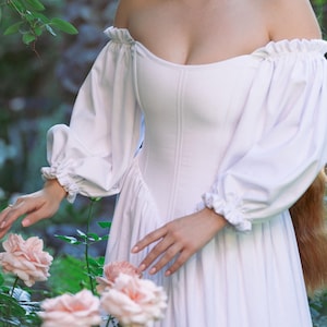 custom made ivory dress with off-shoulder sleeves