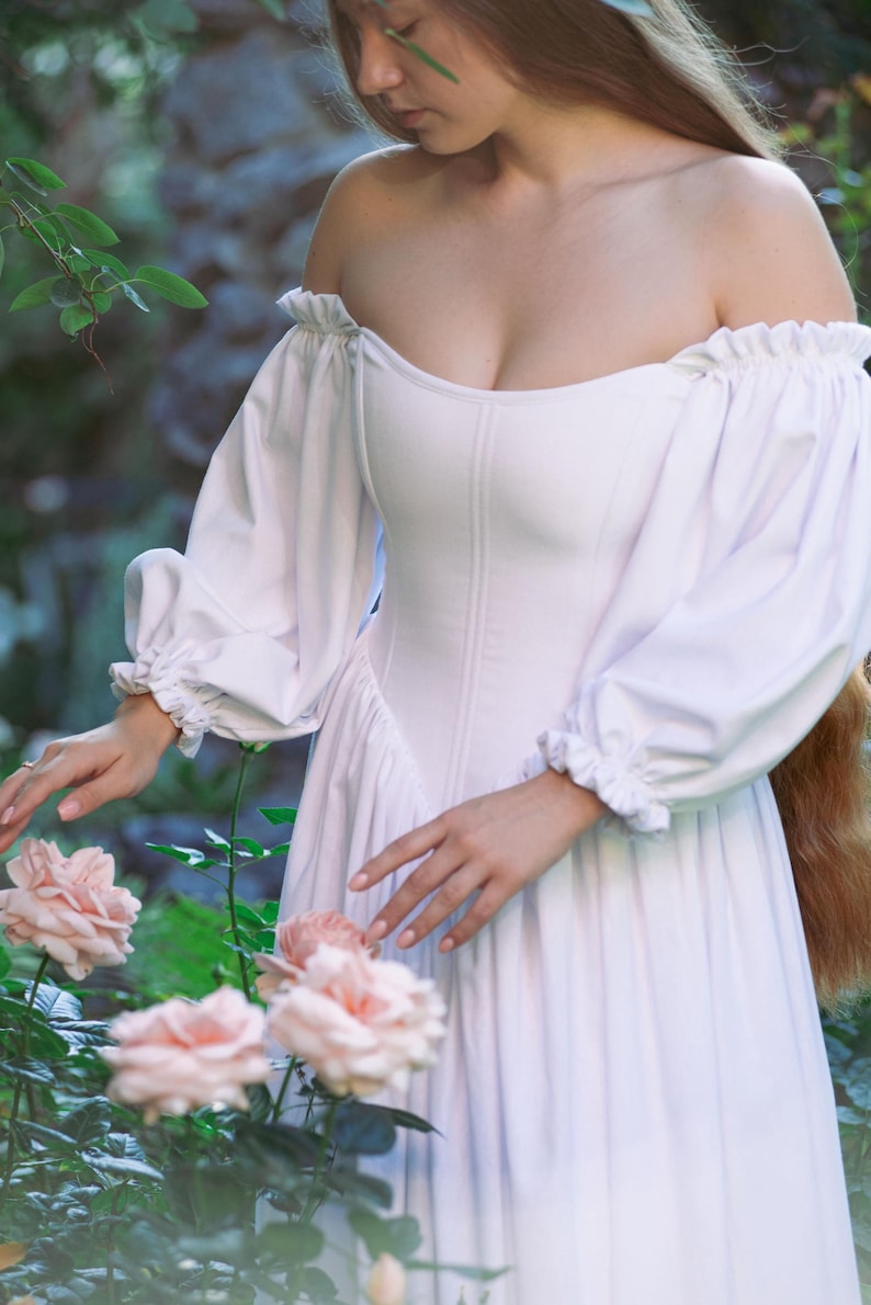 custom made ivory dress with off-shoulder sleeves