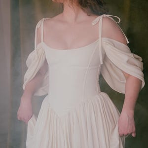 Renaissance inspired corset wedding dress with puff sleeves