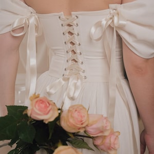 ivory fantasy wedding dress with lace up back and lightweight linen fabric