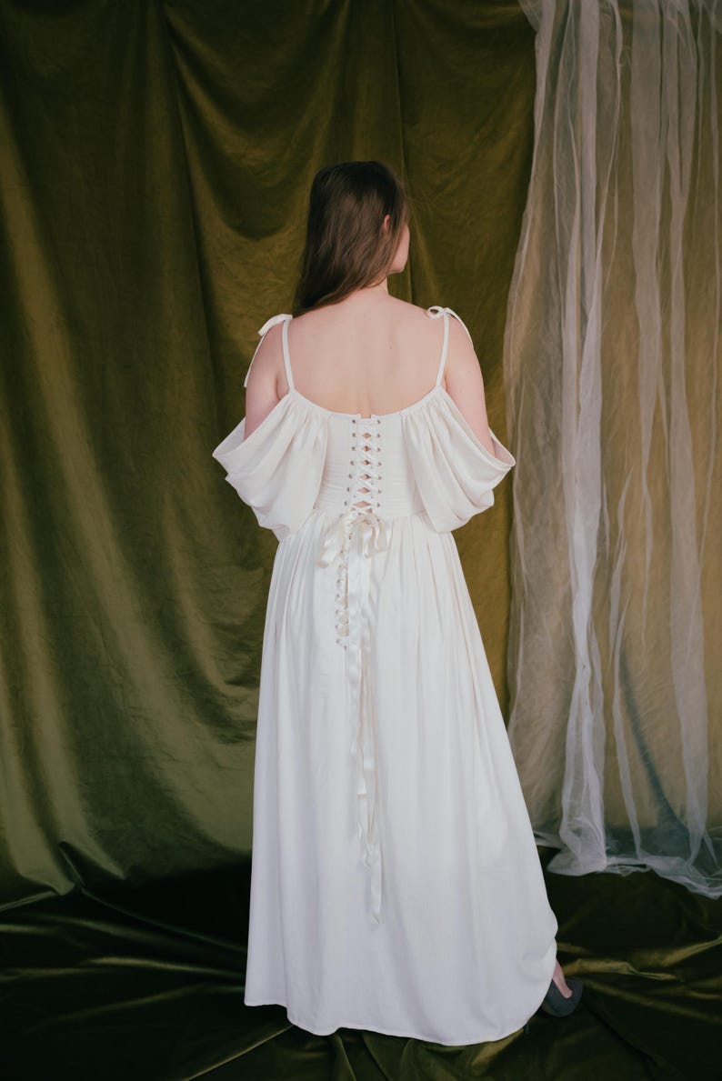 Romantic wedding dress with off shoulder sleeves and full skirt