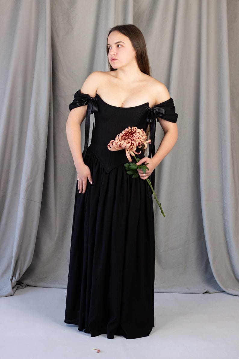 black gothic wedding dress with corset bodice and off shoulder sleeves