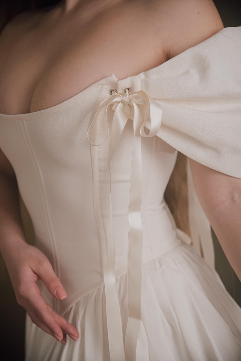 ivory cottage style wedding dress with corset top and full skirt