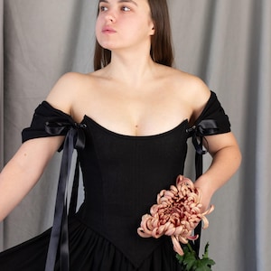 black renaissance inspired corset dress with ribbon sleeves