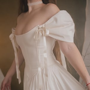 off shoulder ivory linen wedding dress soft romantic bridal gown details