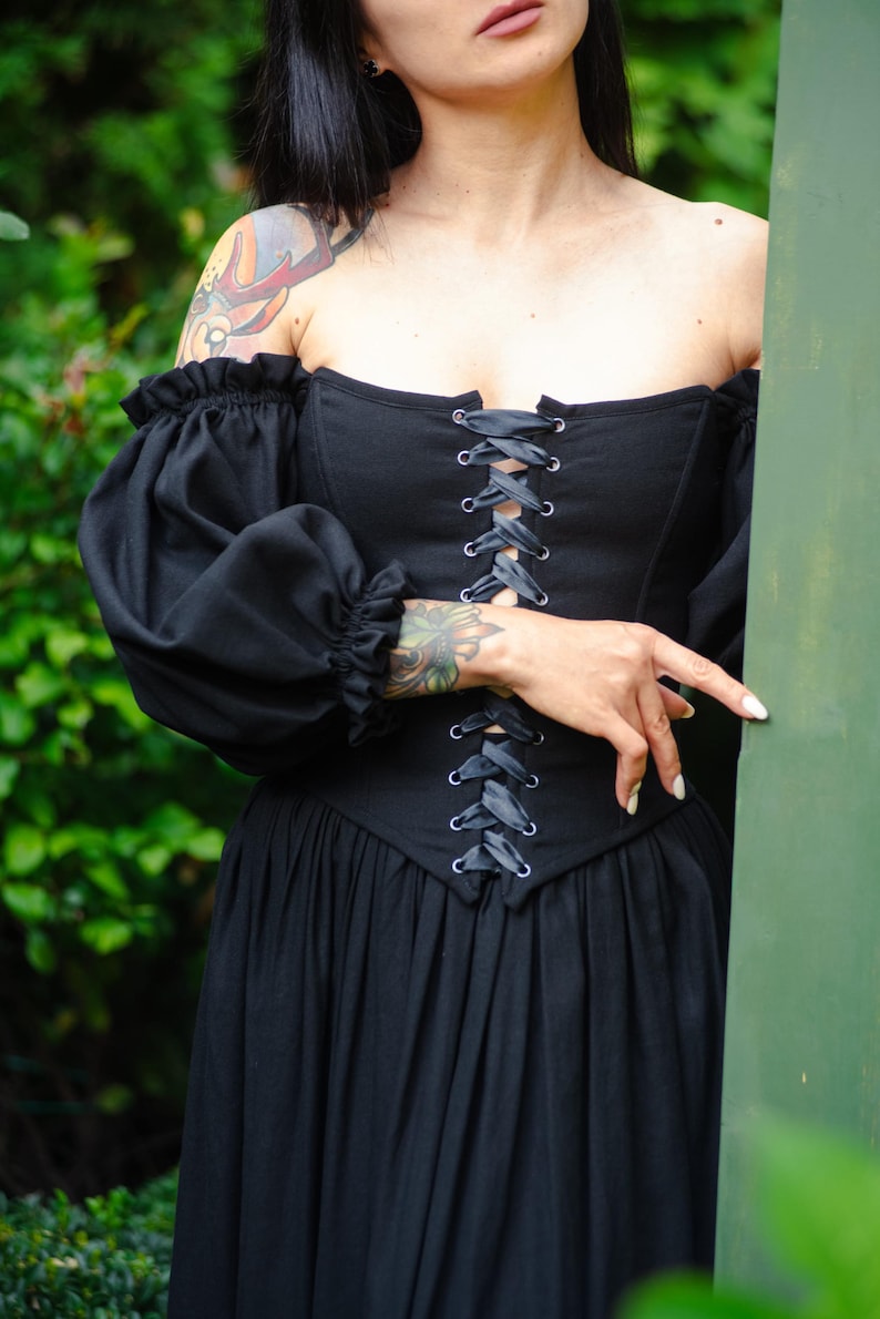 Elegant black corset dress with puff sleeves, historical renaissance silhouette