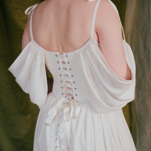 Linen wedding dress with romantic gathered skirt and soft sleeves