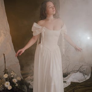 corset lace up bodice ivory wedding dress off shoulder neckline bridal gown detail