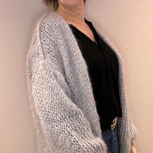 Long pastel colored mohair cardigan.