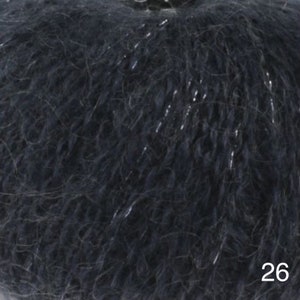 May include: A skein of dark blue yarn with silver glitter threads. The yarn is soft and fluffy, and it is perfect for knitting or crocheting.