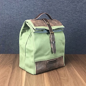 Canvas food bag with handle for easy transport.