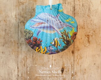 Hanging Dolphin Decoration on a Giant Scallop Shell by Netties Shells