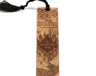May include: A brown wooden bookmark with a black tassel. The bookmark features a map design with the text "The Marauders Map" and "Moony Wormtail Padfoot & Prongs are proud to present..."