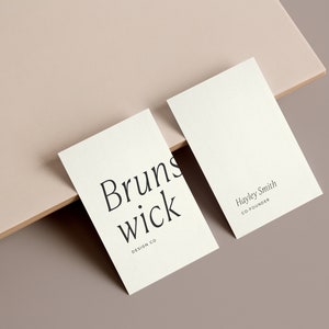 May include: Two white business cards. The first card has the text "Brunswick Design Co." The second card has the text "Hayley Smith Co-Founder".
