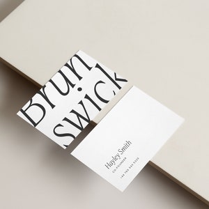 May include: Two white business cards. The top card has the word "Brunswick" repeated in a diagonal pattern. The bottom card has the text "Hayley Smith, Co-Founder, +44 7703 583 530".