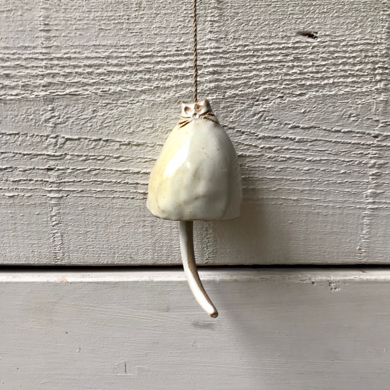 Daisy unique gift for a cat lover! Ceramic cat bell with an off-white shiny glaze