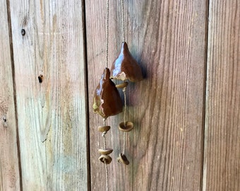 Two beautiful ceramic bells with a brown shiny glaze. Handmade ceramic wallhanging.