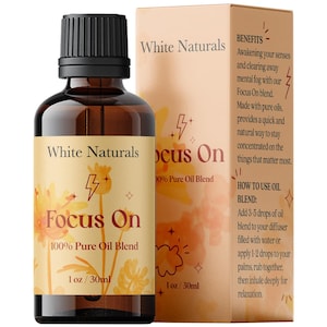 May include: A brown glass bottle with a yellow label that reads "White Naturals Focus On 100% Pure Oil Blend 1 oz / 30ml". The bottle is sitting on a white surface. The background is a yellow and orange watercolor design with a lightning bolt symbol.